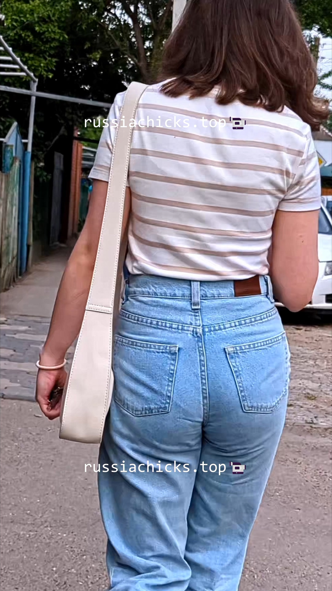 teen girl on street in jeans with vpl