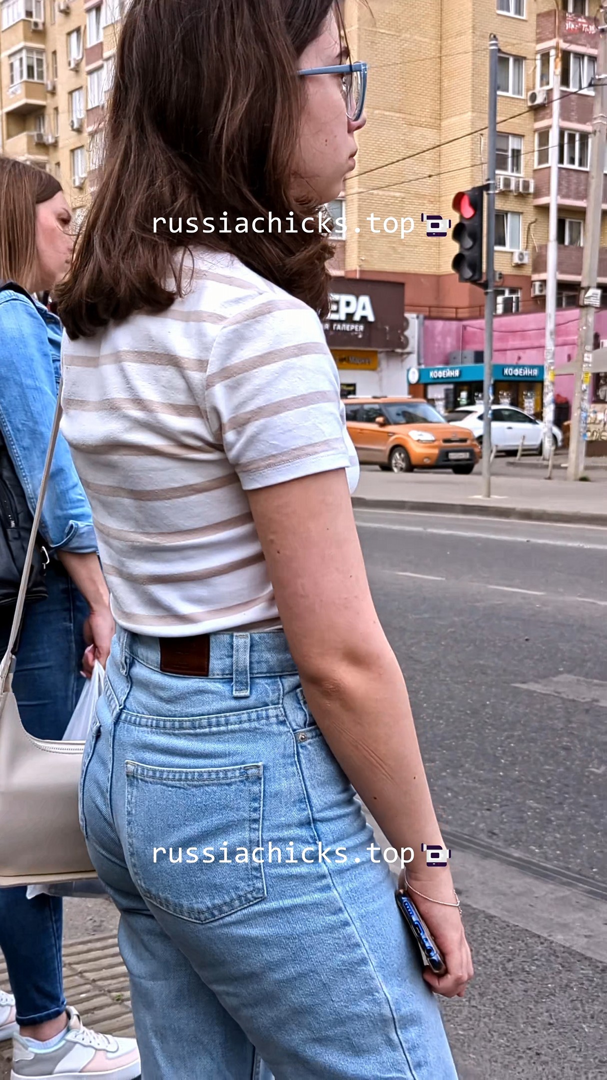teen girl on street in jeans with vpl