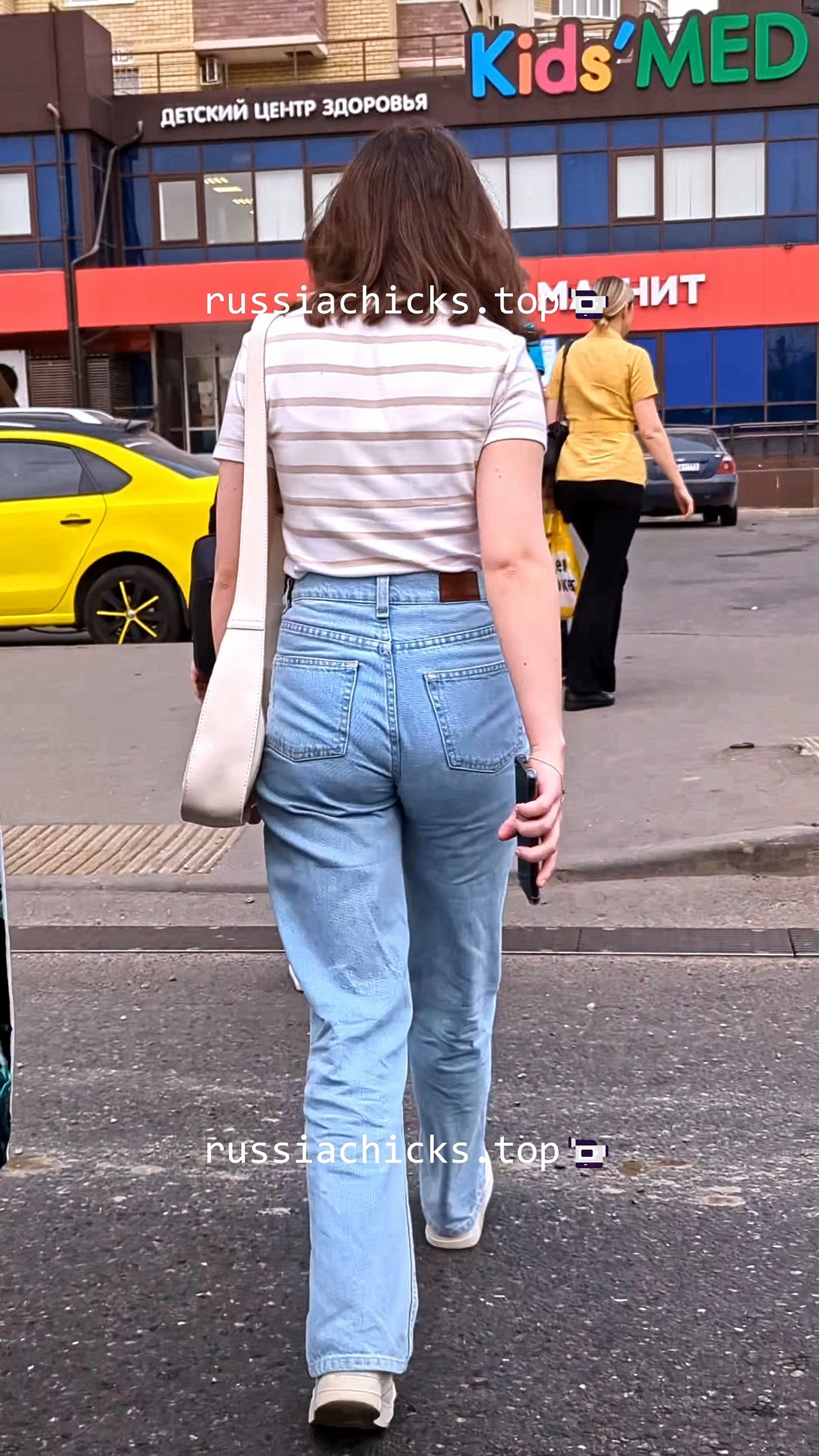 teen girl on street in jeans with vpl