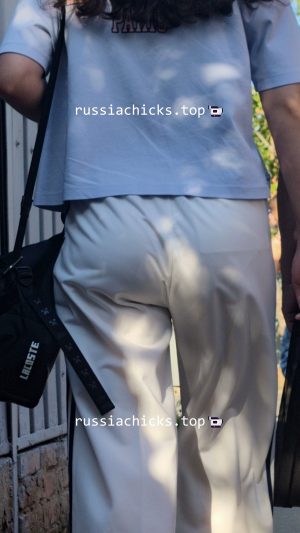 nice teen girl in white pants on street