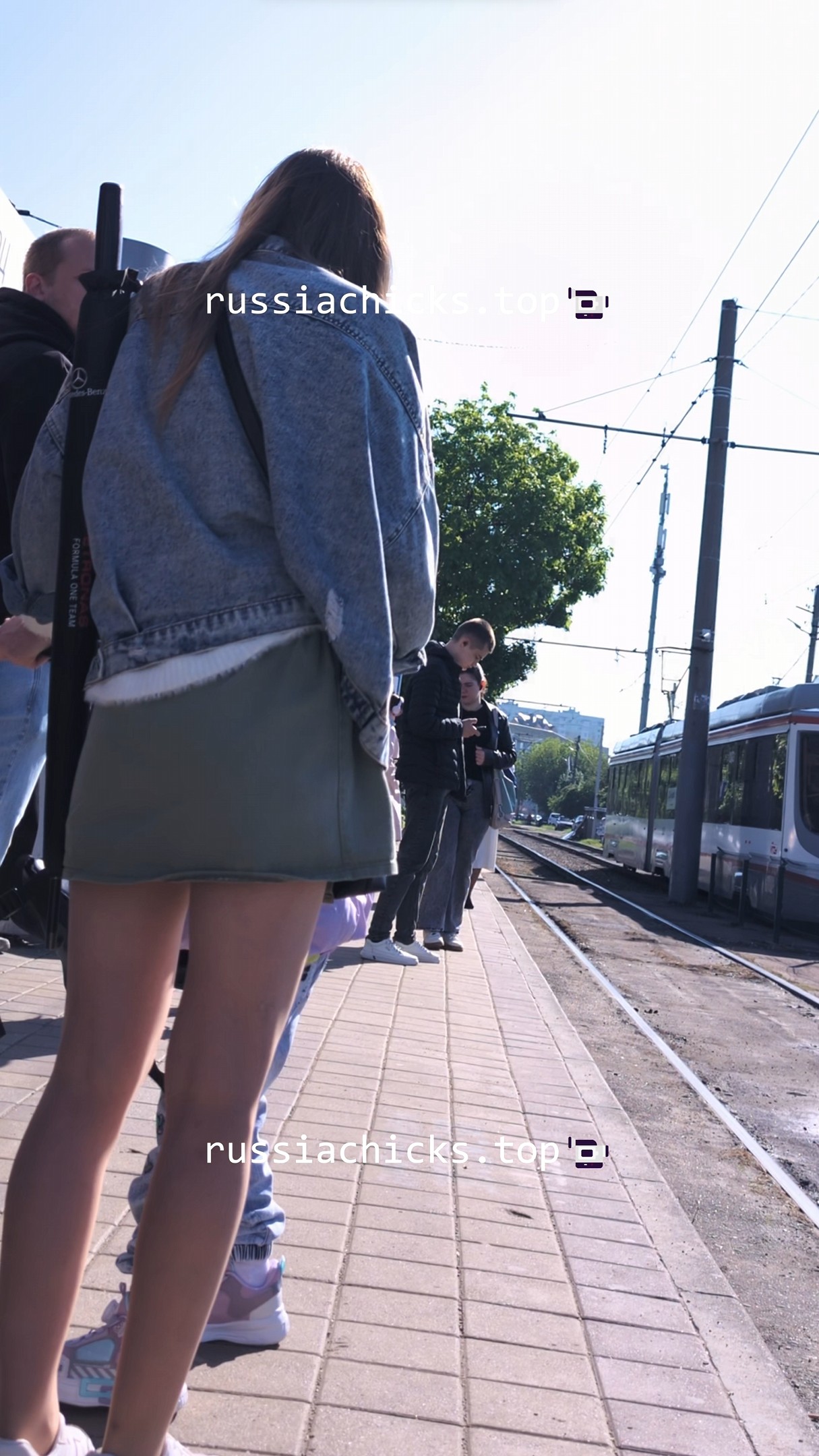 i shots young mommy in dress in tram